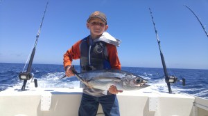 10 -year old Austin Scilacci had his hands full landing his first-ever tuna while fishing near Crescent City last Friday. Austin , along with his father Bryan, were fishing with Marc Schmidt of Coastline Charters. Photo courtesy of Bryan Scilacci