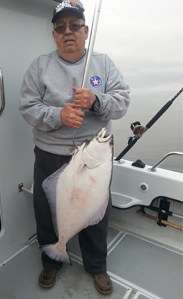 Lewis Richey of Fortuna, who was fishing as part of the Humboldt Veterans group, landed a nice Halibut on Monday out of Eureka. Martin Abshire, who runs the boat “Reel Time,” volunteered his time to take Richey as well as fellow veterans Steve Emmons of Fortuna, and Eric Hollenbeck of Eureka down to Cape Mendocino for a fun day of fishing. Photo courtesy of Martin Abshire